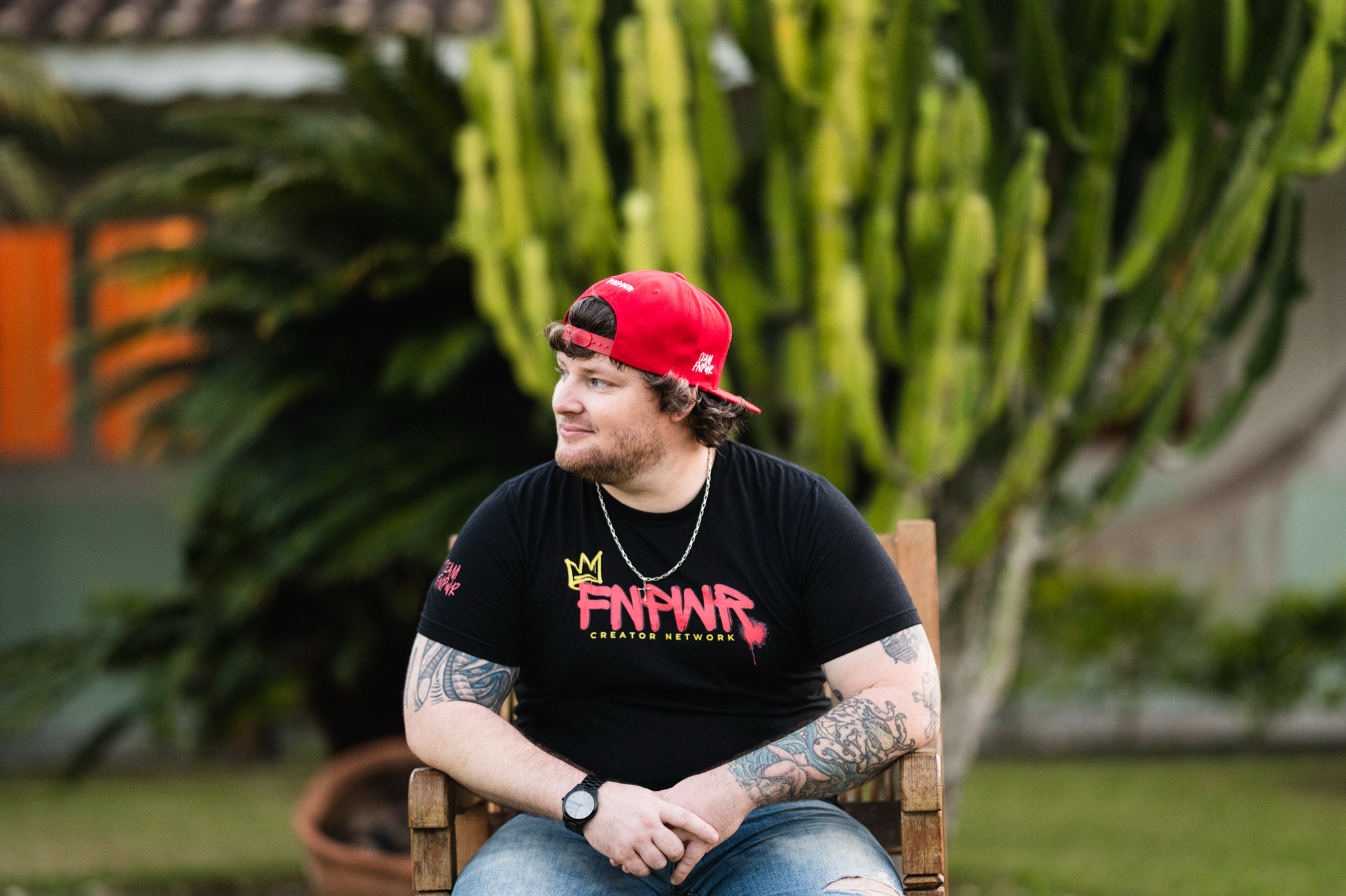 Ryan Bailey, known as Fox, wearing an FNPWR shirt and red cap